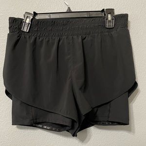 Athleta HIIT IT 2-in-1 black shorts size large.